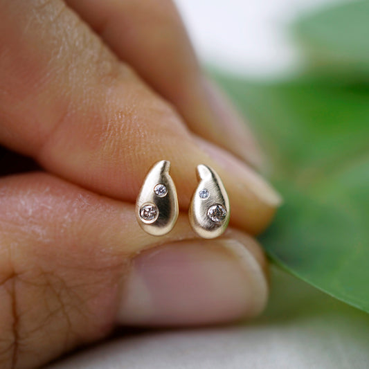Custom 14k teardrop earrings with diamond accent